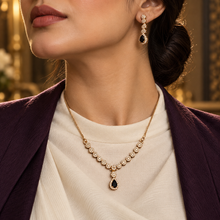 Black Celestia teardrop necklace and earrings styled with a formal outfit