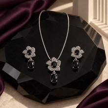 Liora Black floral pendant necklace with matching stone drop earrings