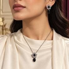 Model wearing the Liora Black floral necklace and matching drop earring