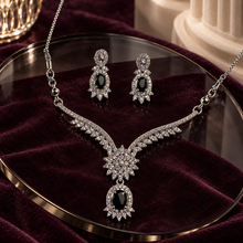 Black Elysia Winged Drop necklace with matching silver-tone earrings
