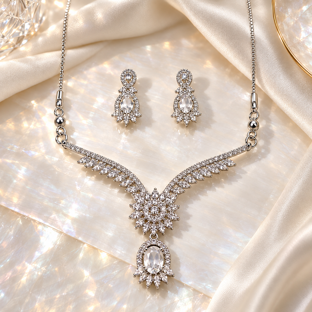 Clear Elysia Winged Drop necklace with matching silver-tone earrings