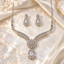 Clear Elysia Winged Drop necklace with matching silver-tone earrings