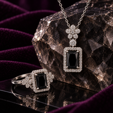 Black Fiora Bloom pendant necklace and matching ring close-up
