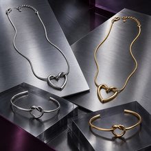 Close-up of the Nova open-heart pendant and threaded-loop cuff bracelet