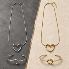 Gold and Silver Nova Loop Heart pendant and bracelet sets displayed side by side