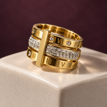 Angled view of the Vela layered gold ring showing its vertical bar detail