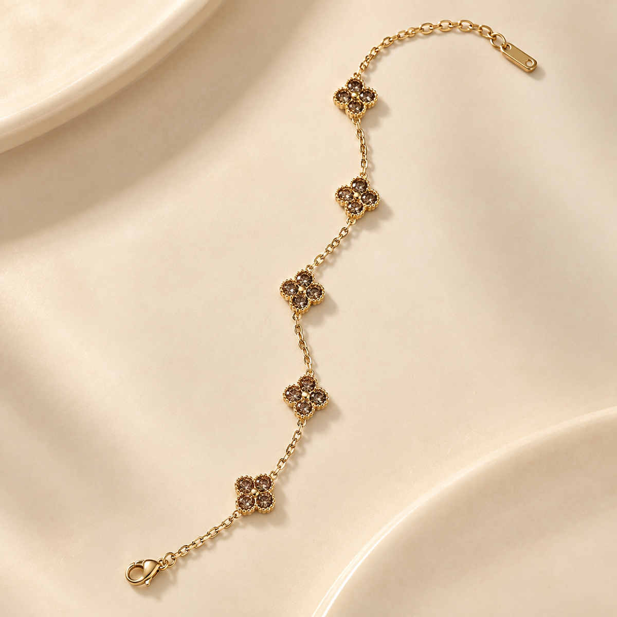 Liora Champagne Brown crystal clover bracelet with gold-tone chain