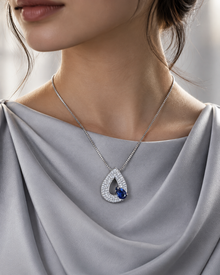 Sapphire Blue Selene S925 silver teardrop pendant necklace worn with a modest silver outfit